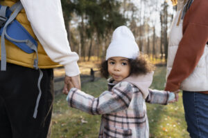 cute boy walking with his chosen guardians