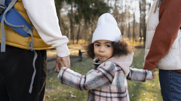 cute boy walking with his chosen guardians