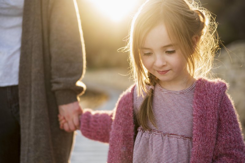 cute girl walking with her chosen guardian