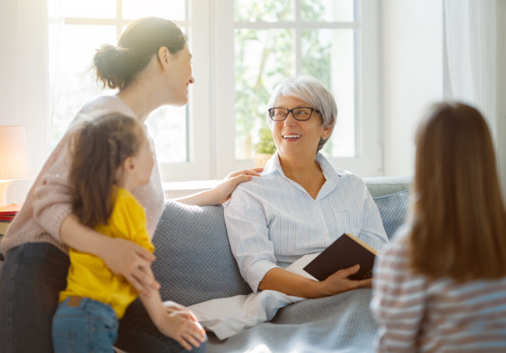 Multigenerational family talking at home.